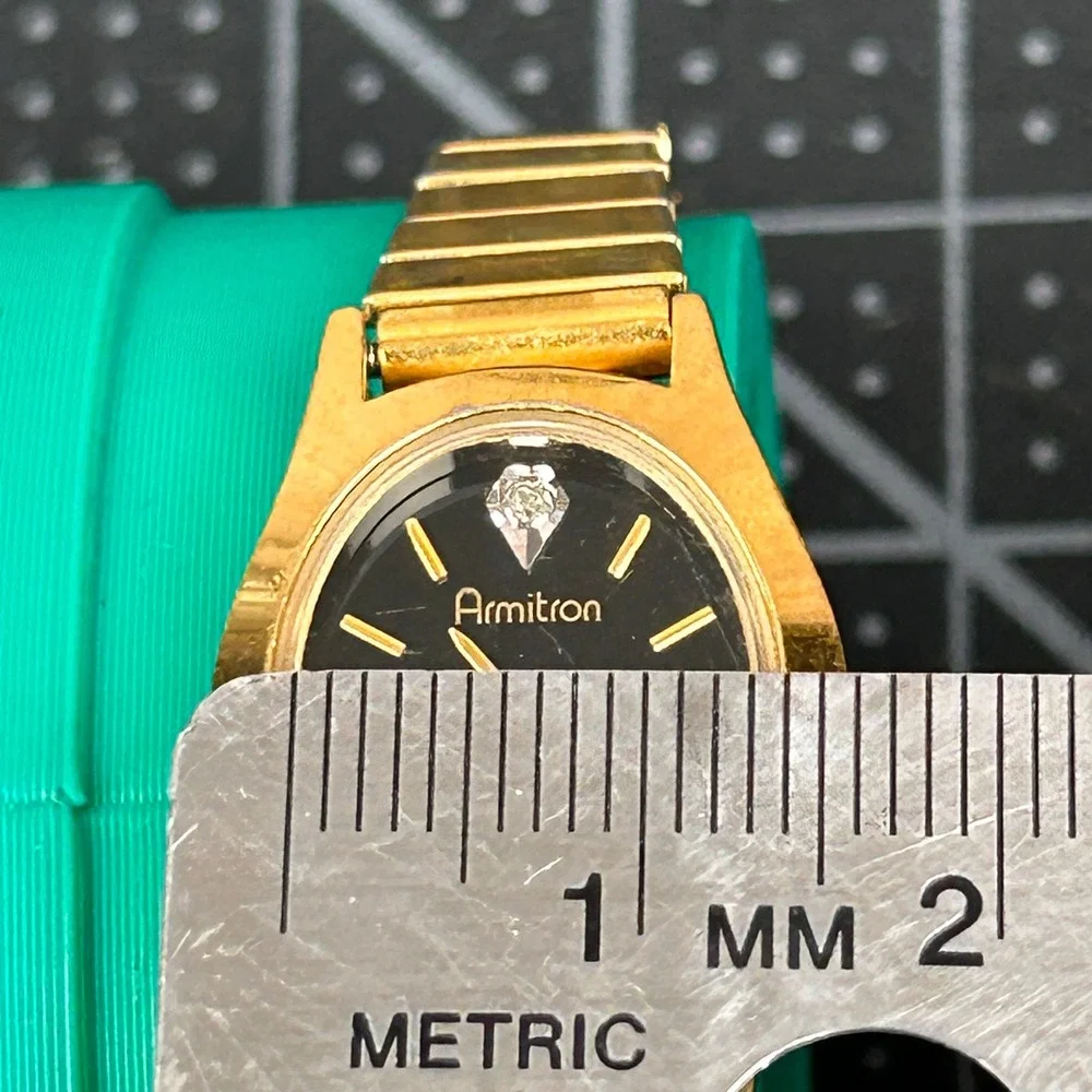 Armitron Diamond Quartz Womens Watch Gold Tone Black Dial Oval 25/5116‎ 400/101